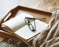eye glasses on tray in bed